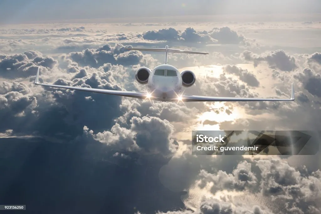 Private Jet Flying over clouds